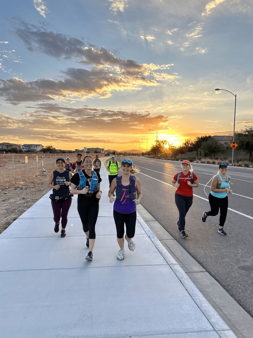 A group of people walking down the street